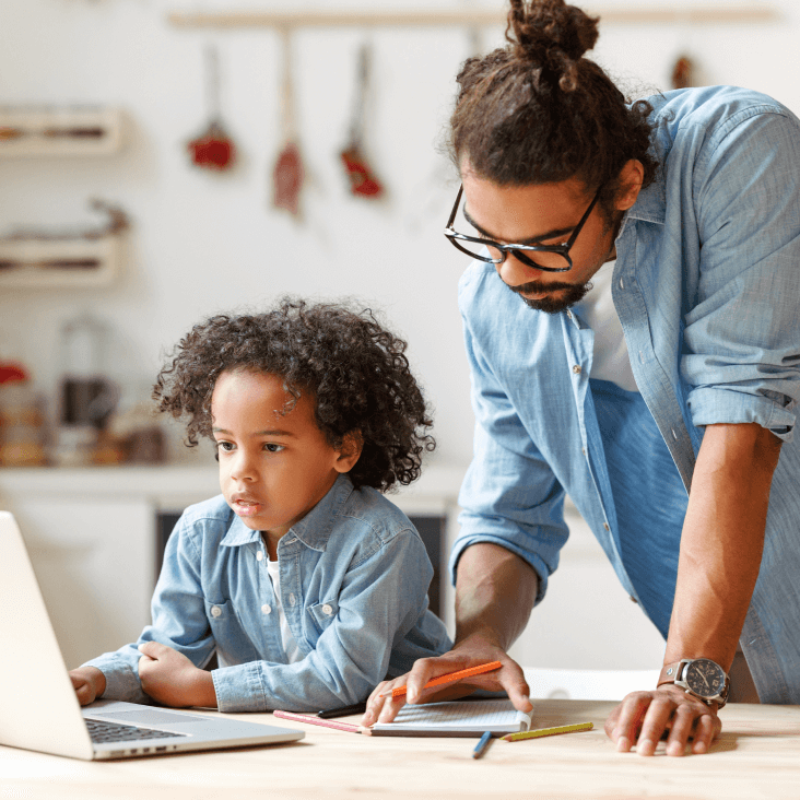 A father helping his son with his studies.